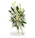 Standing sympathy spray arrangement featuring white lilies, white and yellow roses, snapdragons, carnations, and lush greenery displayed on an easel against a white background.